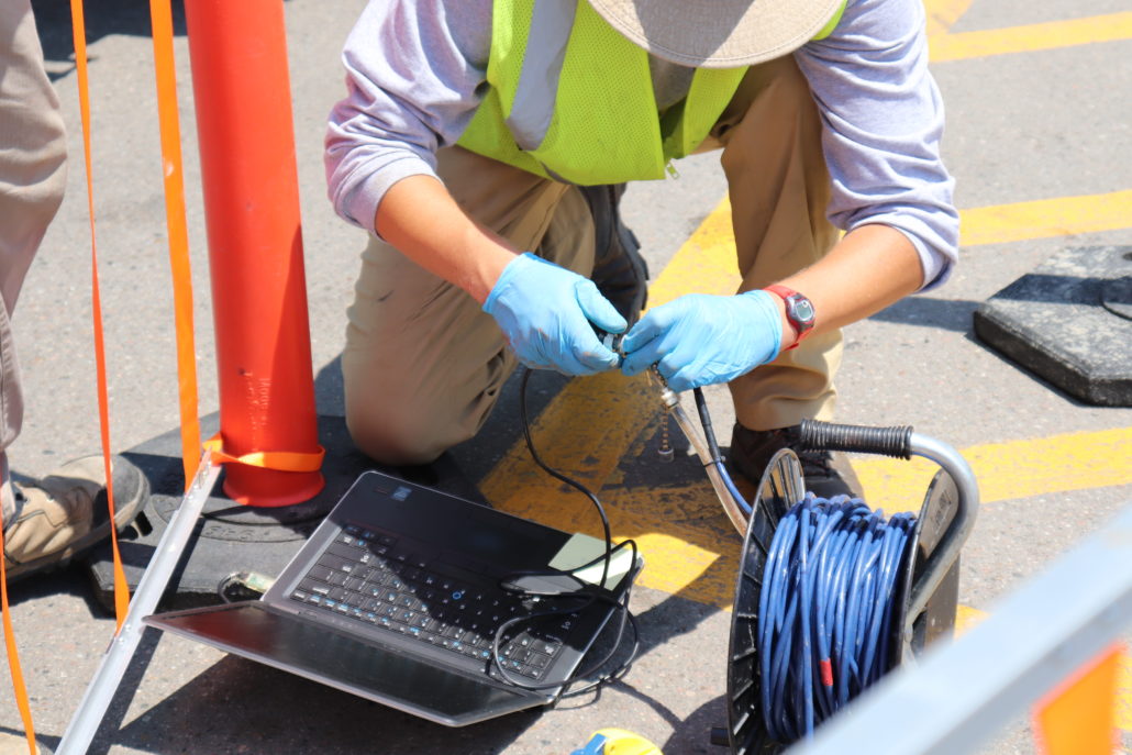 CGRS Water Quality Services CGRS employee doing tests on laptop